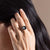 Woman wearing stainless steel moon phase ring