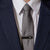 Man wearing moon phase tie bar in matte black stainless steel